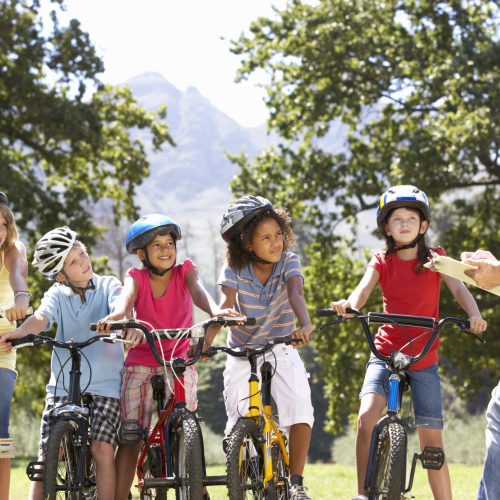 Group,Of,Children,Having,Safety,Lesson,From,Adult,Whilst,Riding